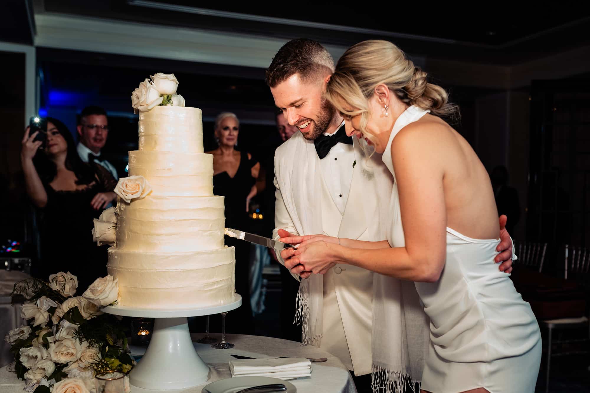 newlyweds cutting their wedding cake