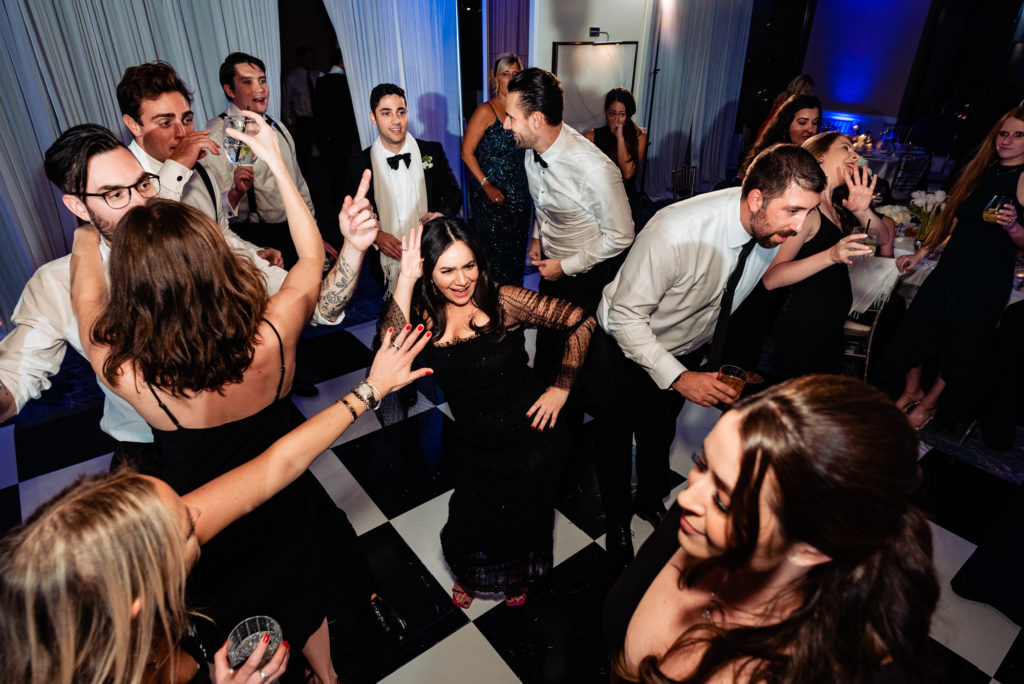 guests having a blast on the dance floor at the four seasons dc wedding venue