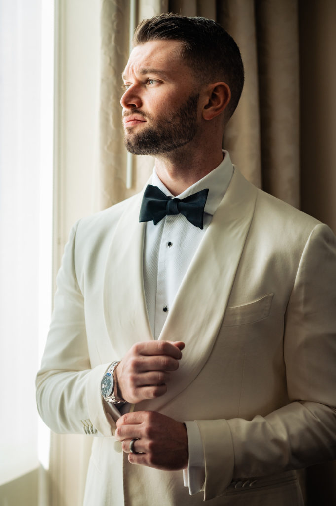 solo shot of the dashing groom