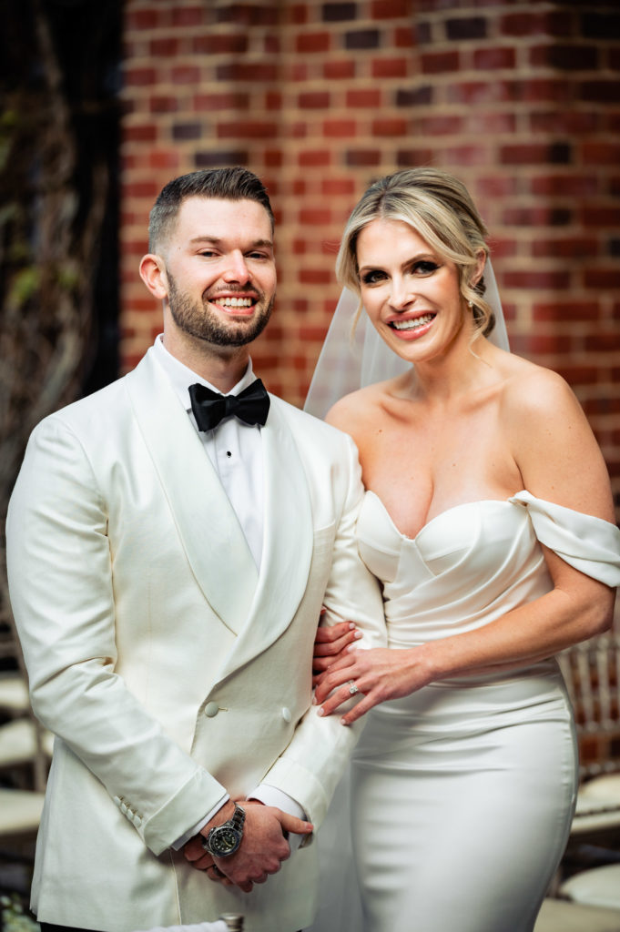 groom and bride taking a pose before the ceremony