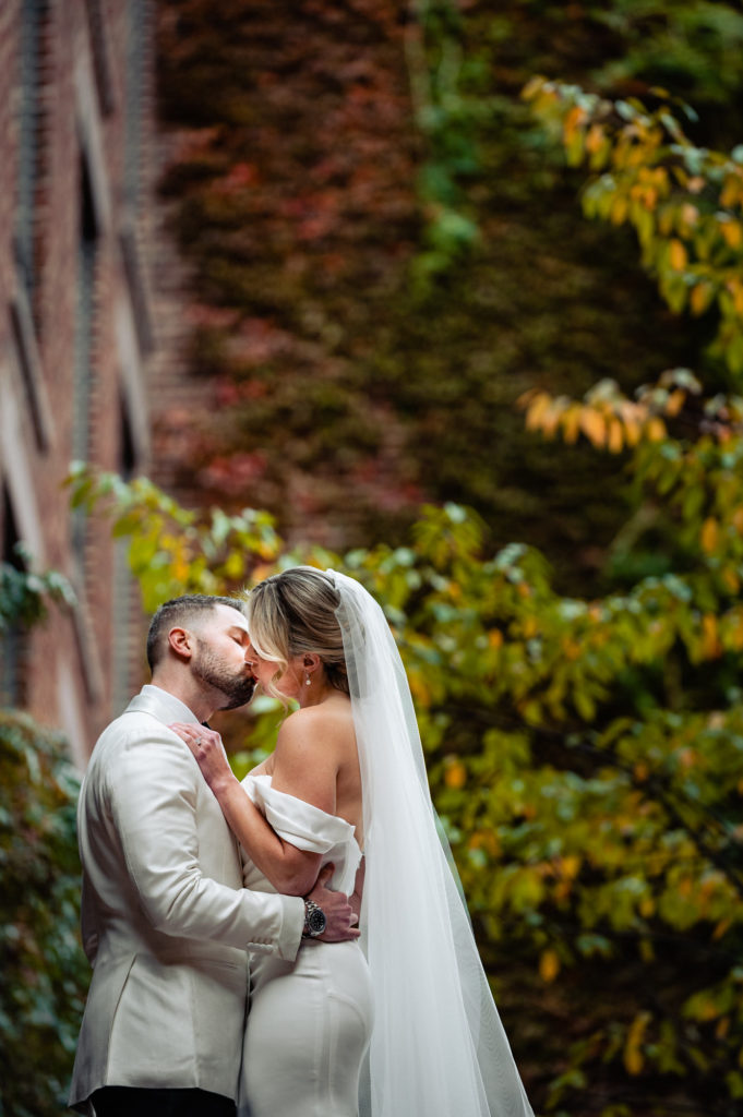 bride and groom kissing before the wedding ceremony