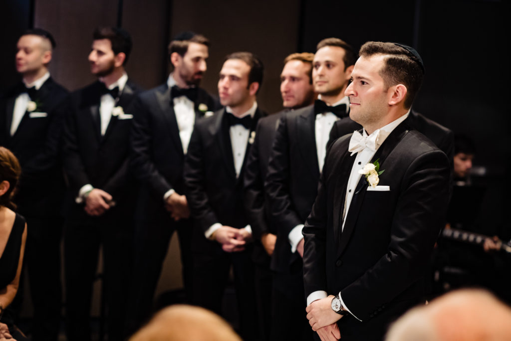 groom waiting for the bride at the altar of the church