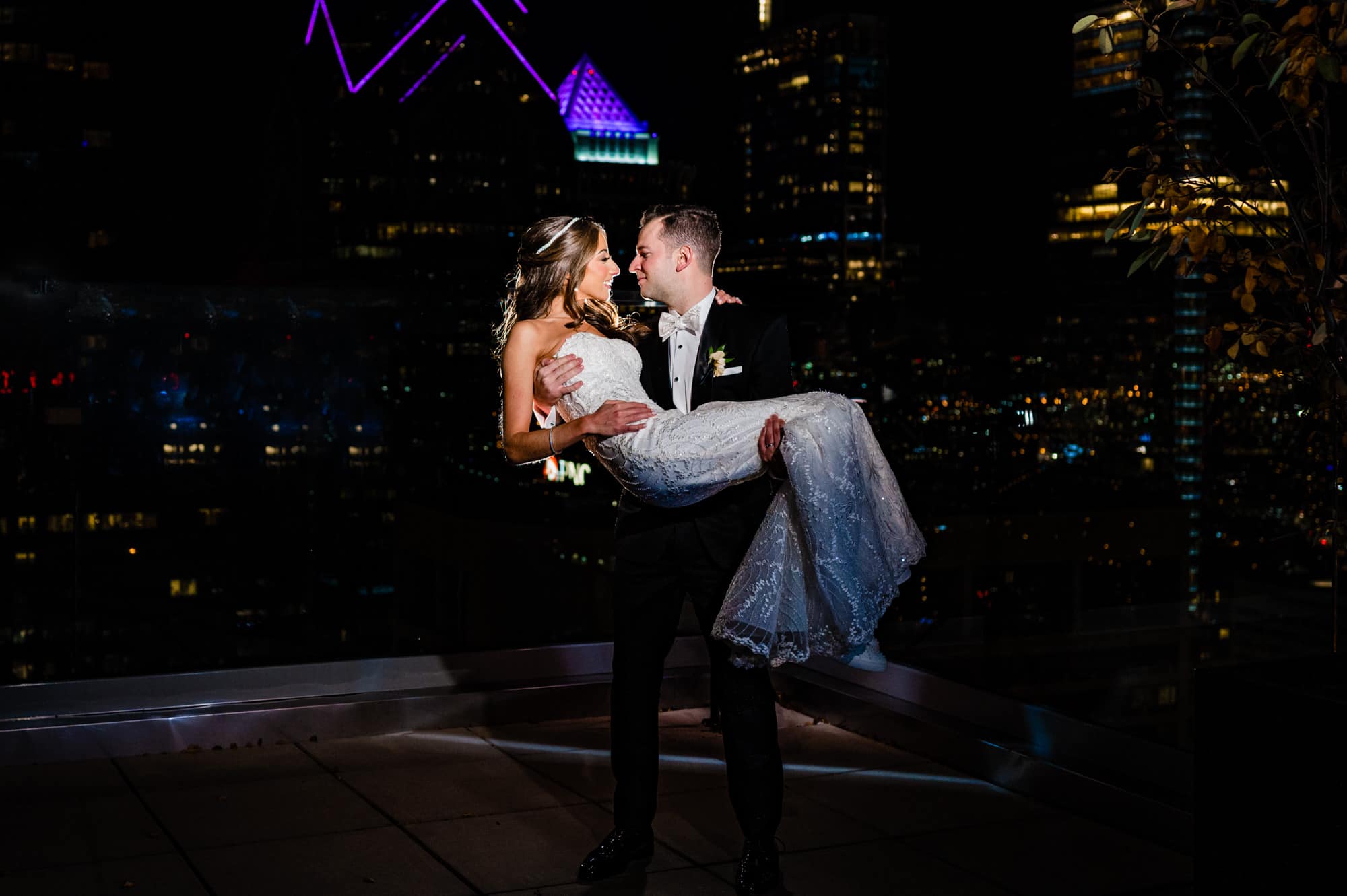 groom carrying her bride at the W Hotel Philly