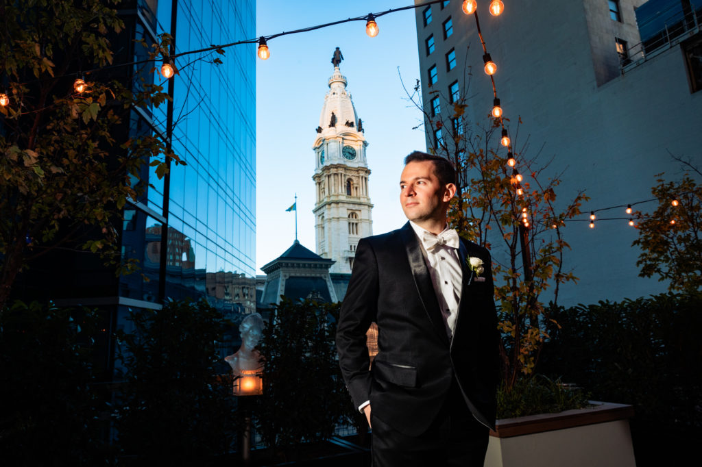 groom with City Hall in background at a W Hotel Philly wedding