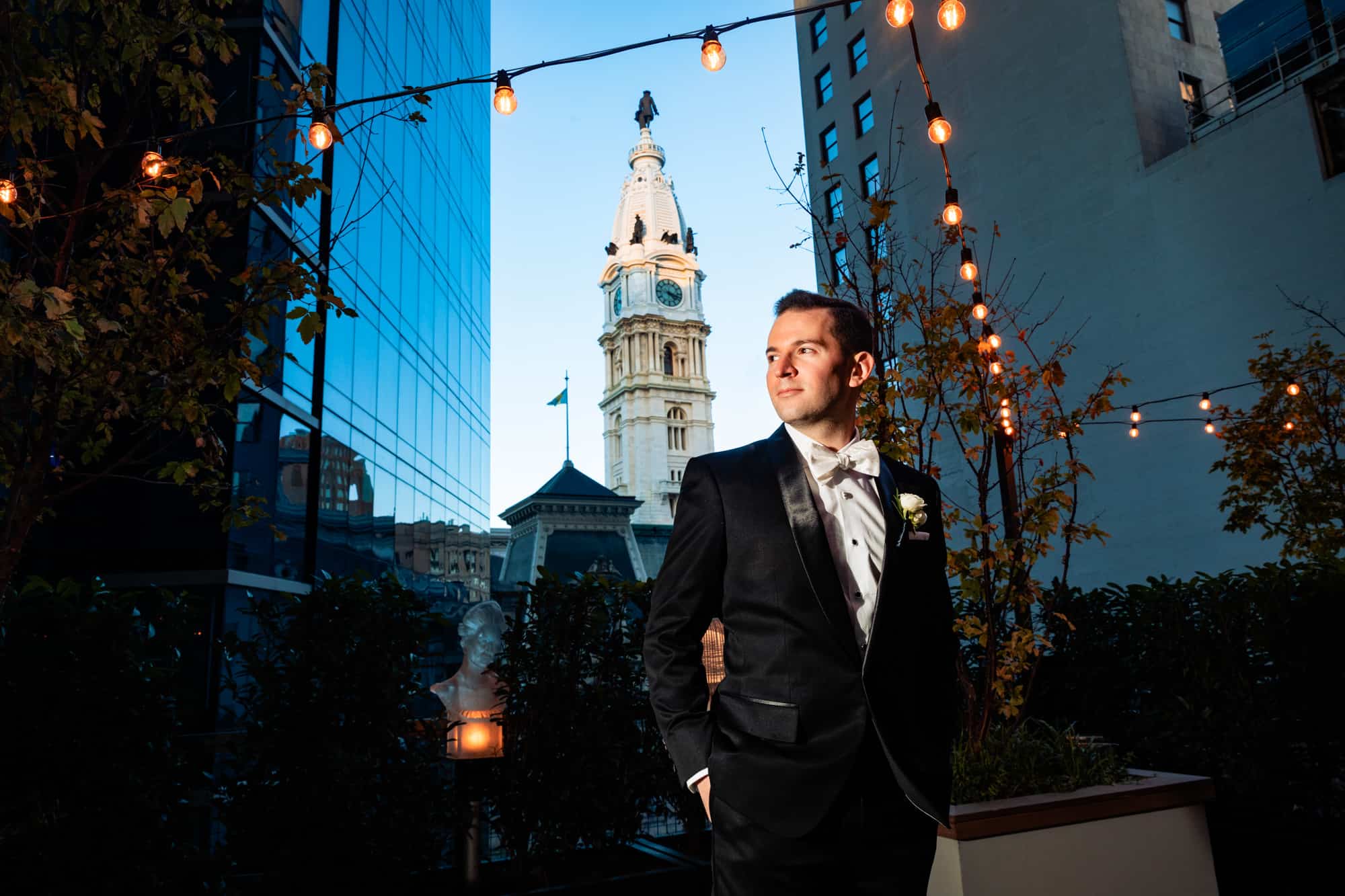 groom with City Hall in background at a W Hotel Philly wedding