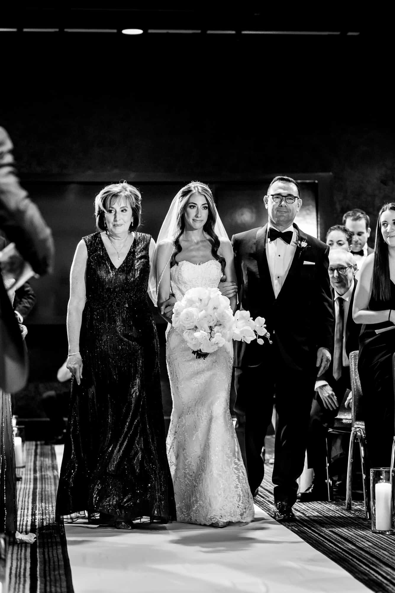 bride walking down the aisle with her parents at a W Hotel Philly ceremony