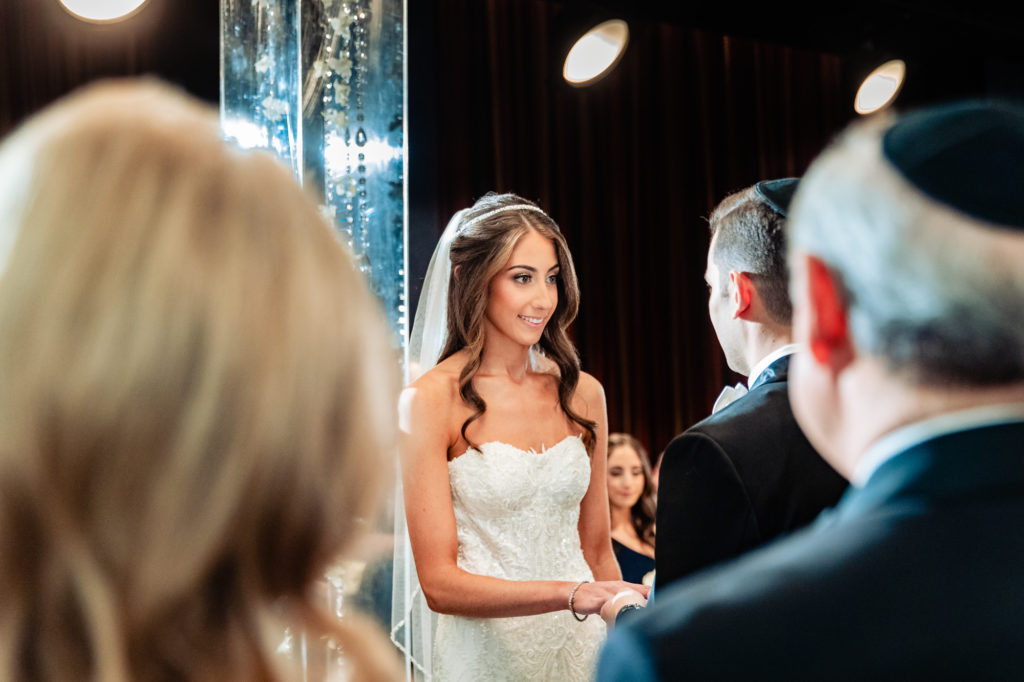bride looking lovingly at her groom during the ceremony