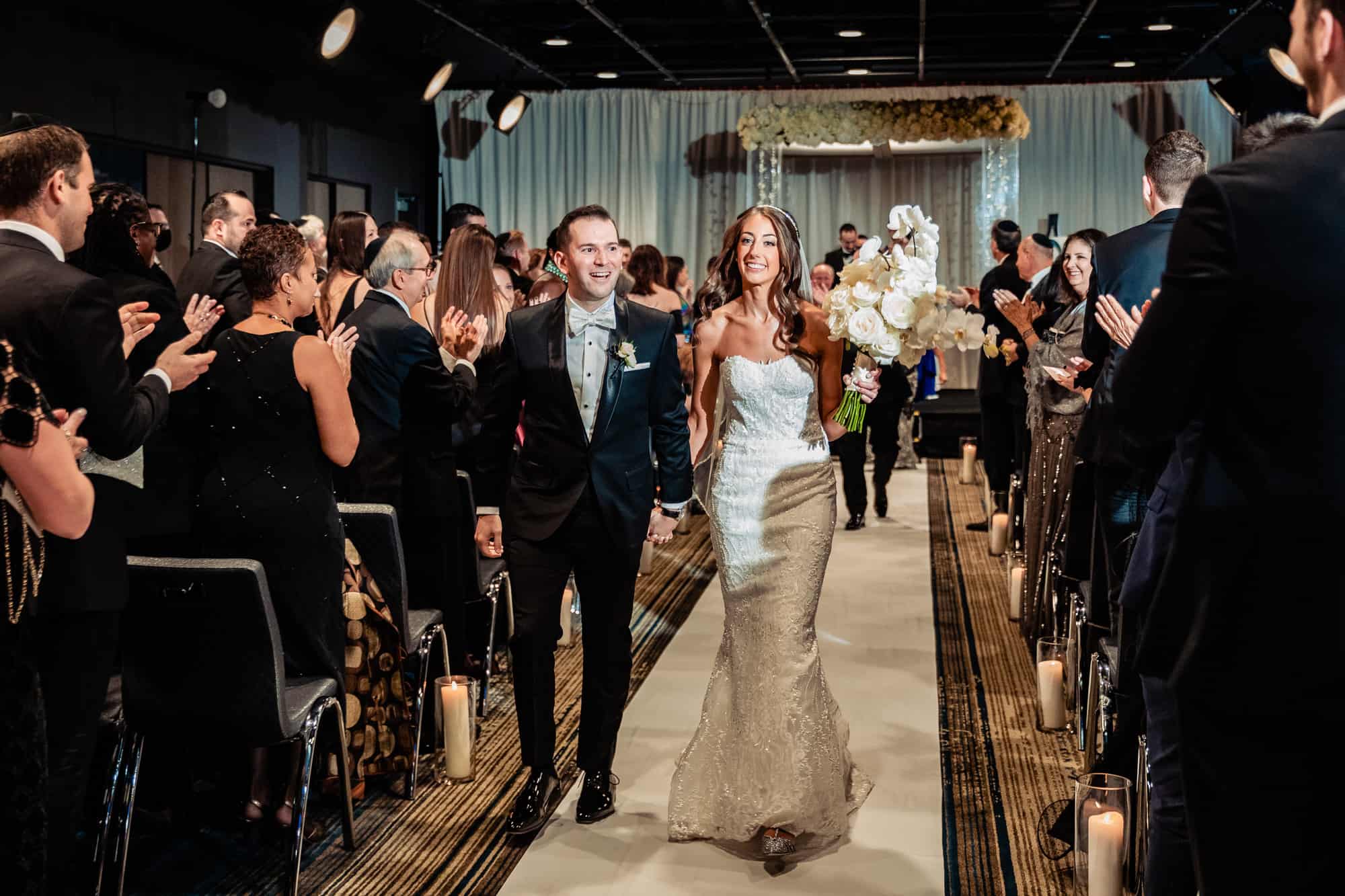 bride and groom walking down the aisle after their W Hotel Philly ceremony