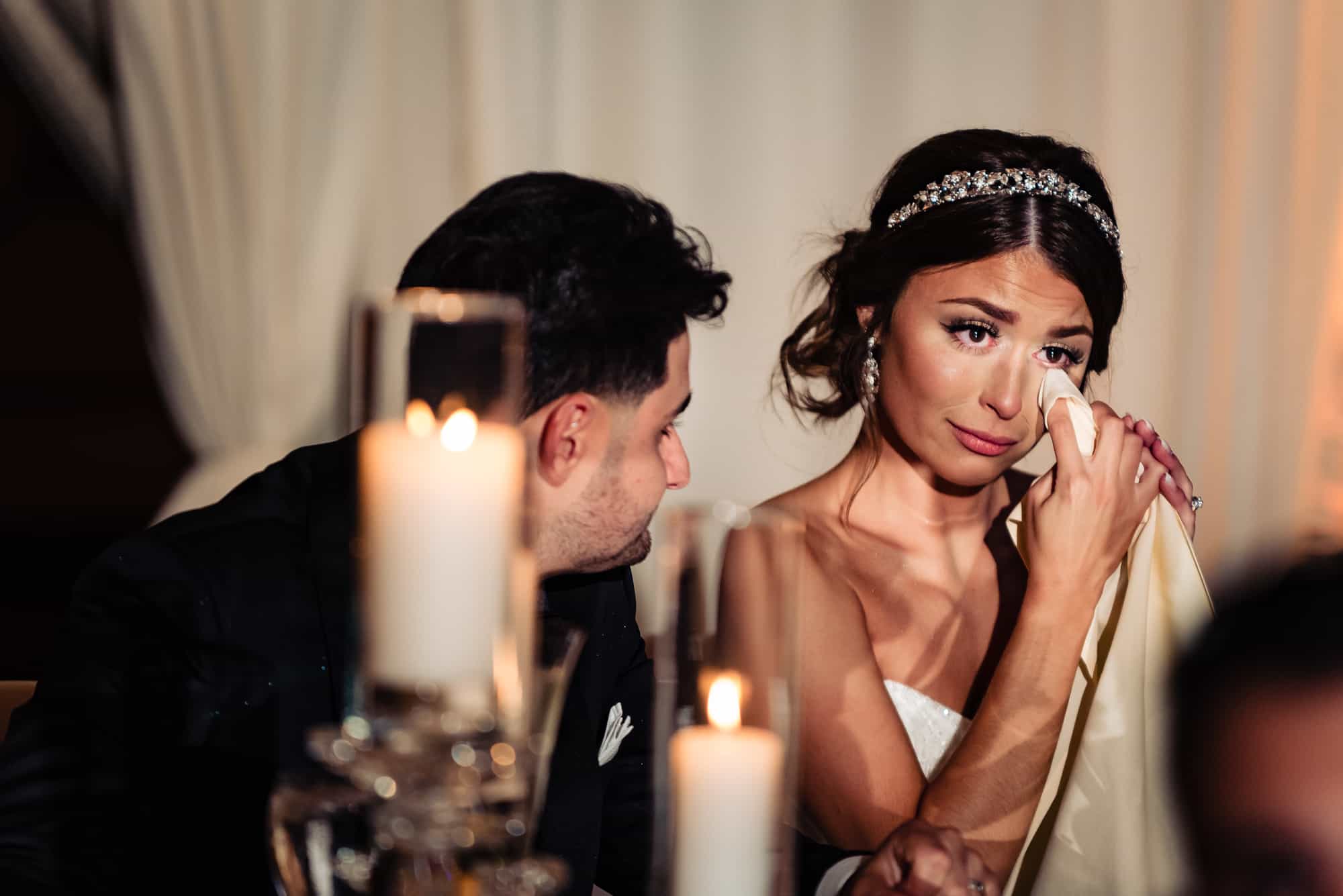 bride is getting emotional at the wedding reception