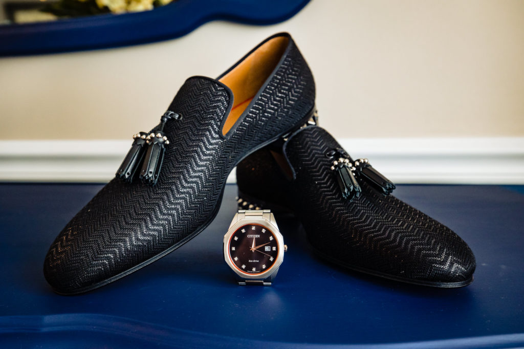 groom's shoes and his watch