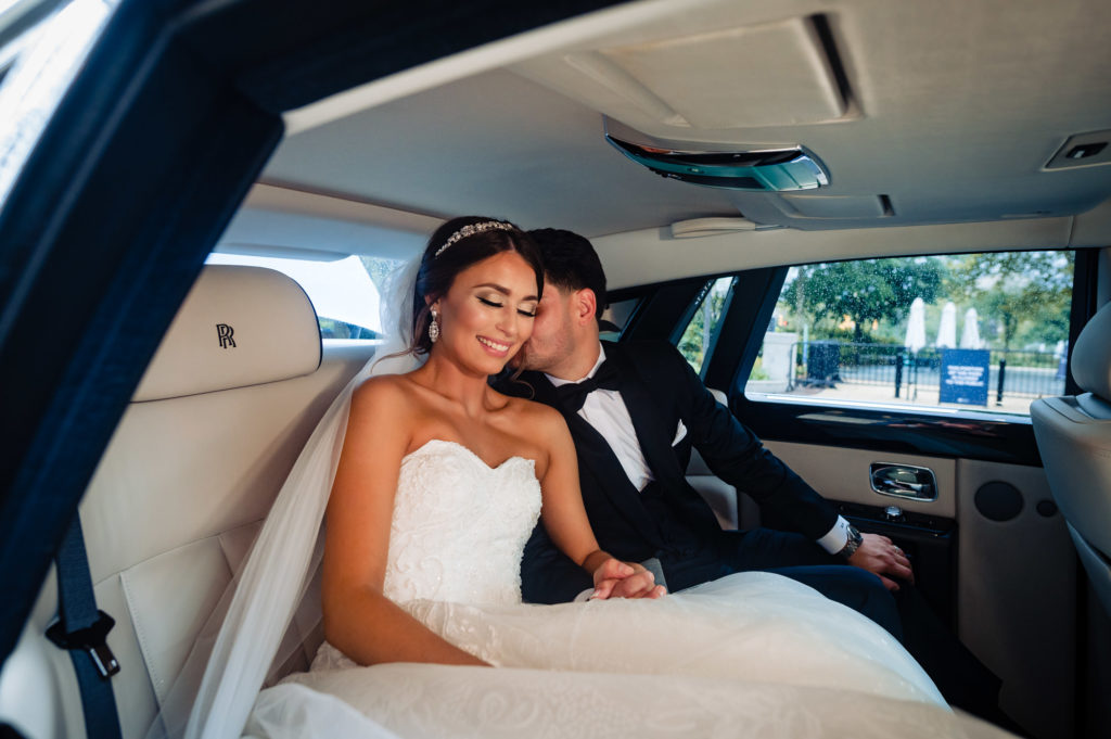 the newlyweds inside their bridal car