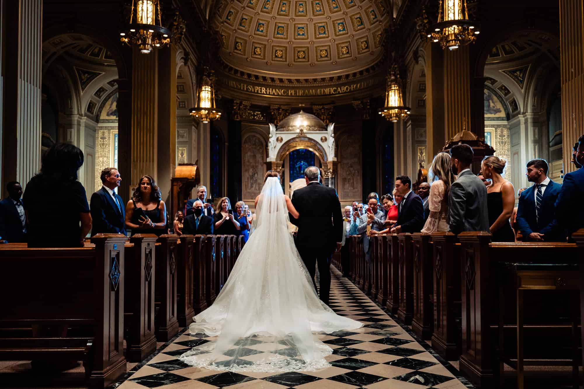 bride walking down the aisle with her father