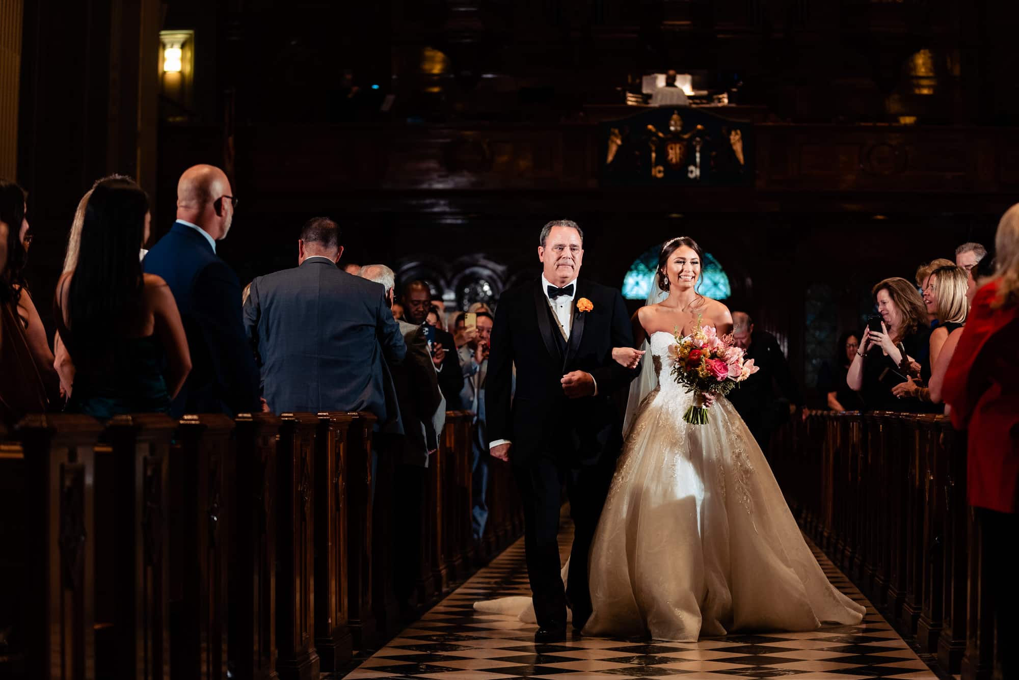 bride walking down the aisle with her father