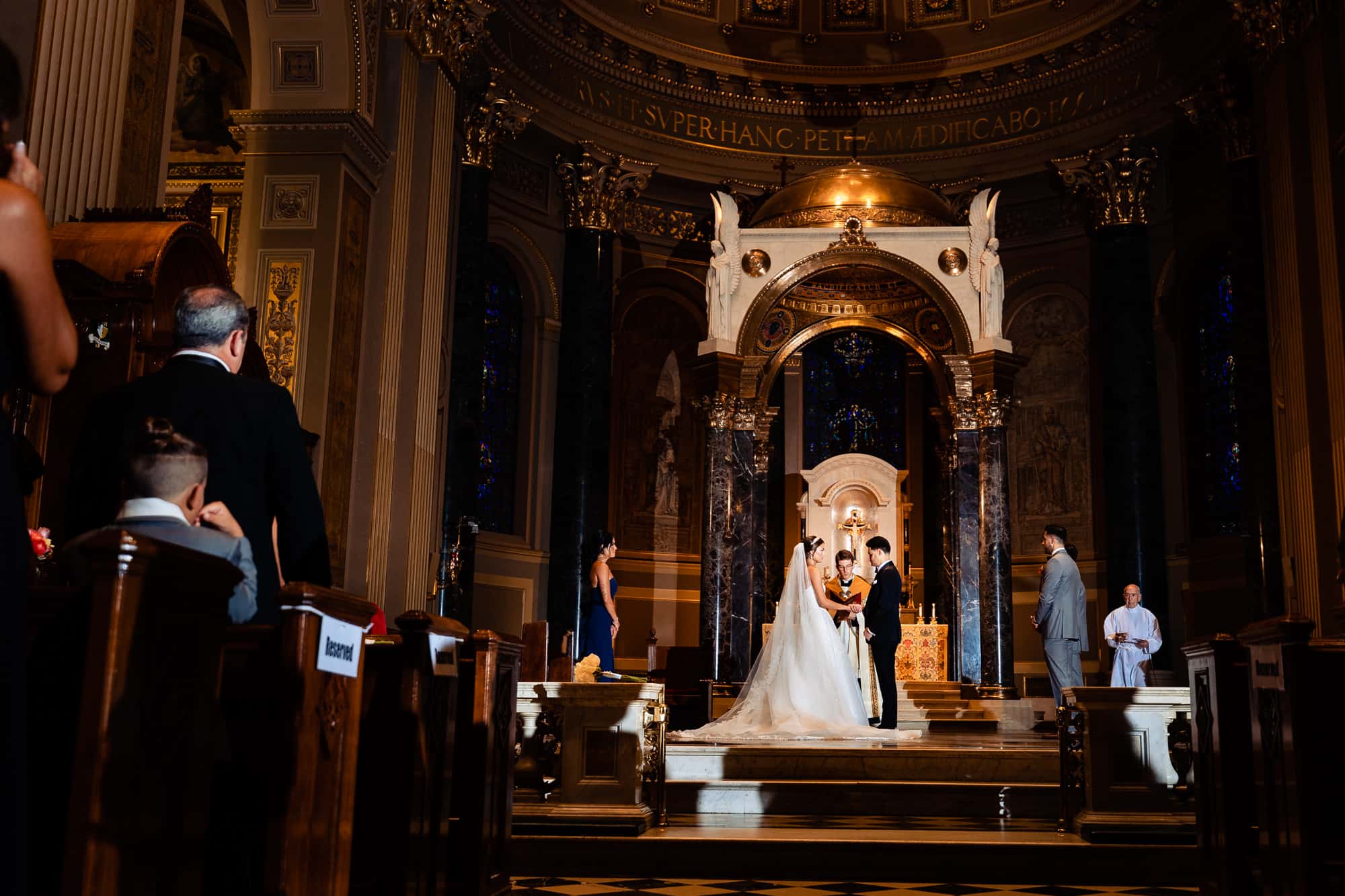 bride and groom at the altar during the wedding ceremony