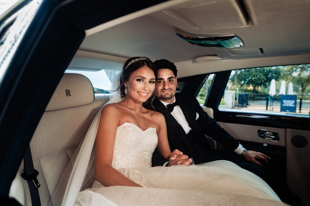 the newlyweds inside their bridal car
