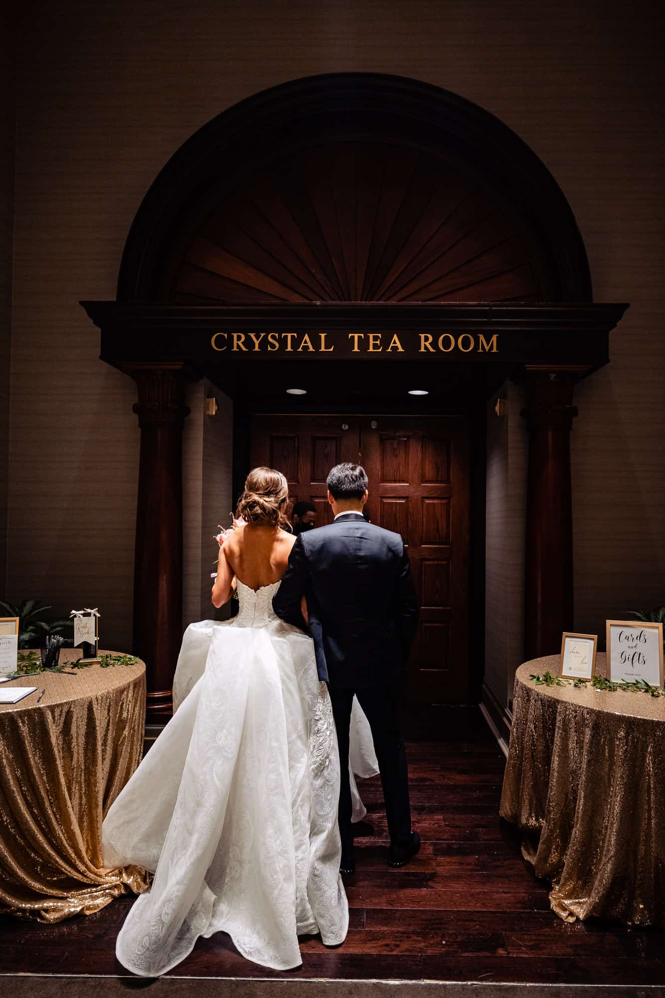 the newlyweds preparing for their entrance at the crystal tea room