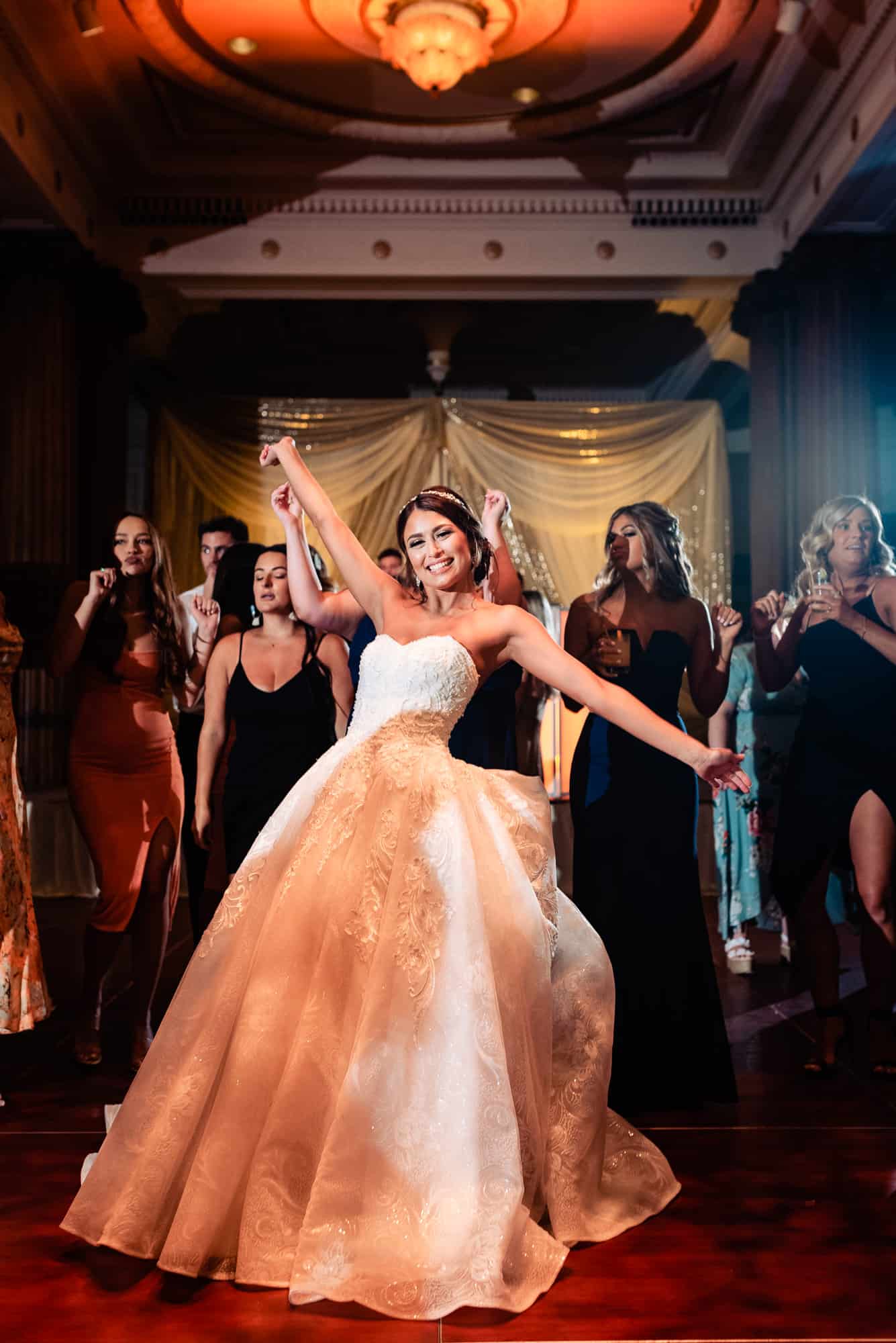 bride is having a blast at her wedding party