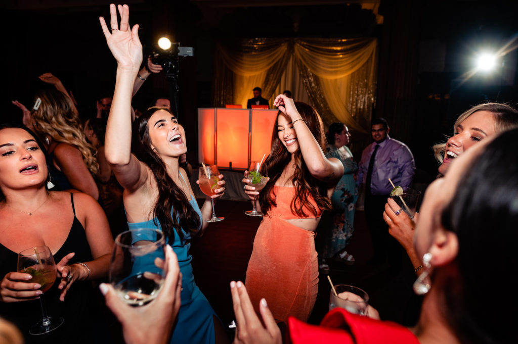 guests having a blast on the dance floor at the crystal tea room wedding venue