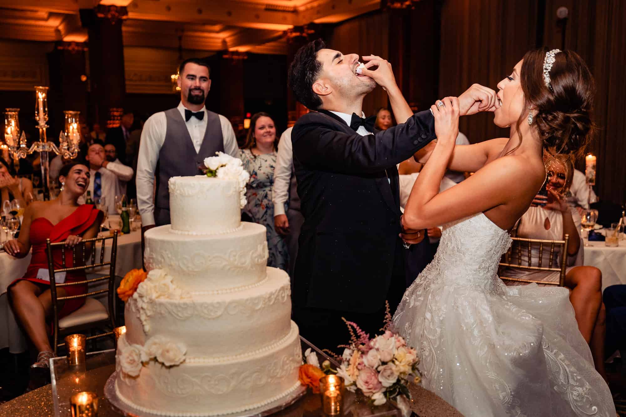 couple eating their wedding cake