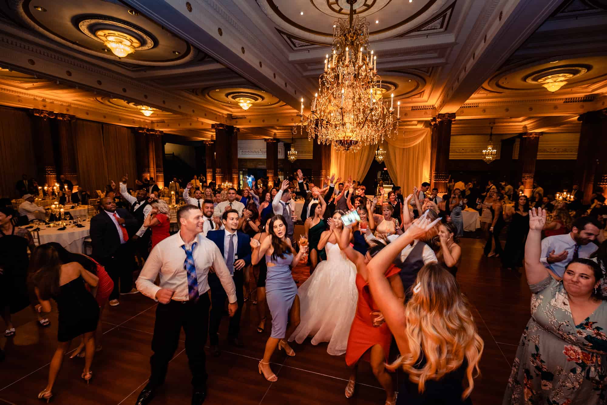 guests having a blast on the dance floor at the crystal tea room wedding venue