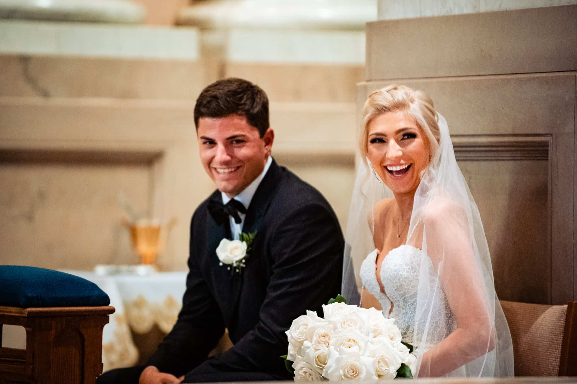 a light moment between the bride and groom on the altar