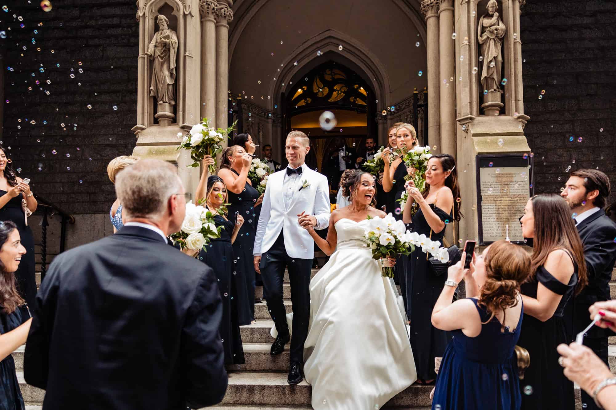 the couple's grand exit showered with bubbles