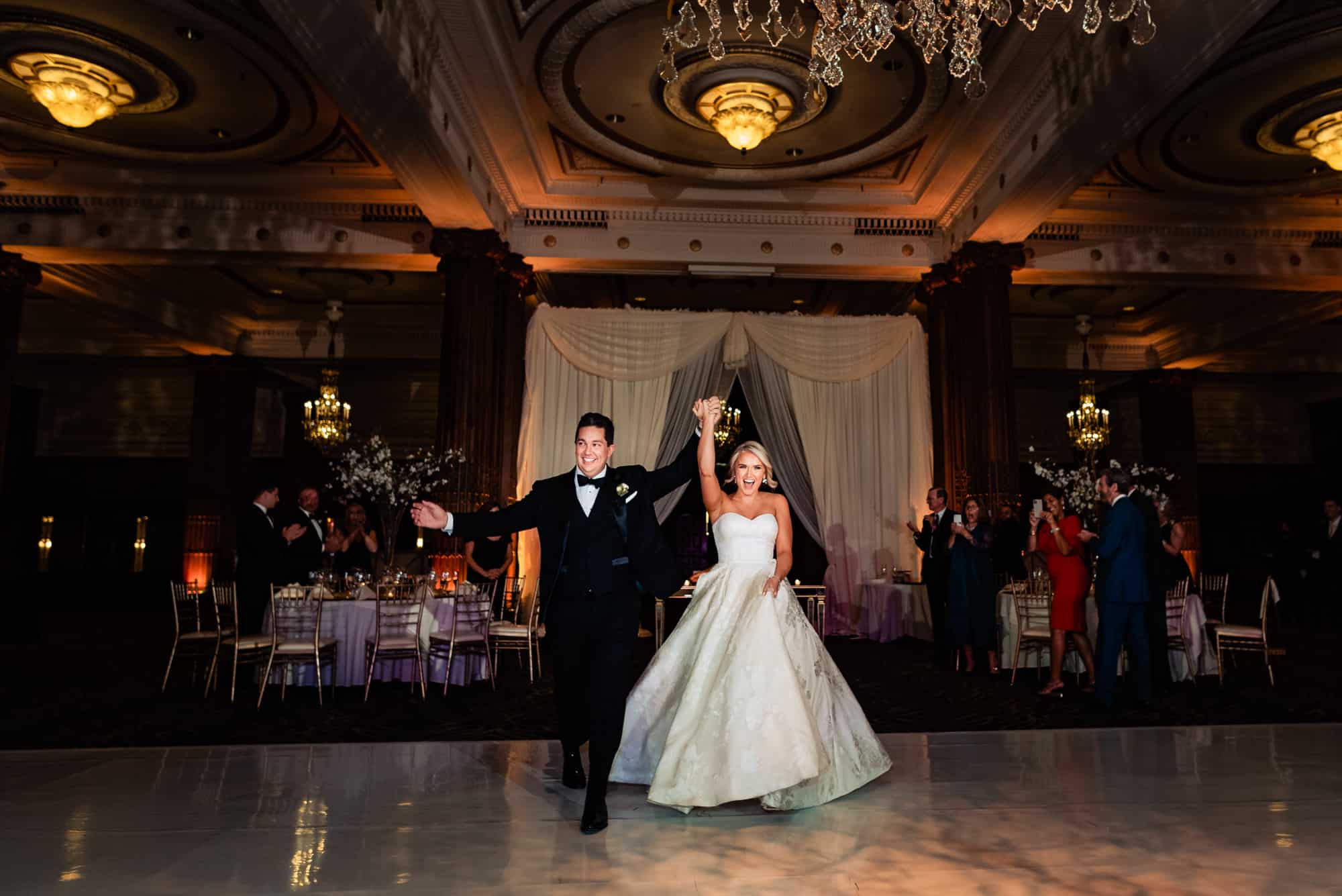 the newlyweds on the floor at the Crystal Tea Room venue