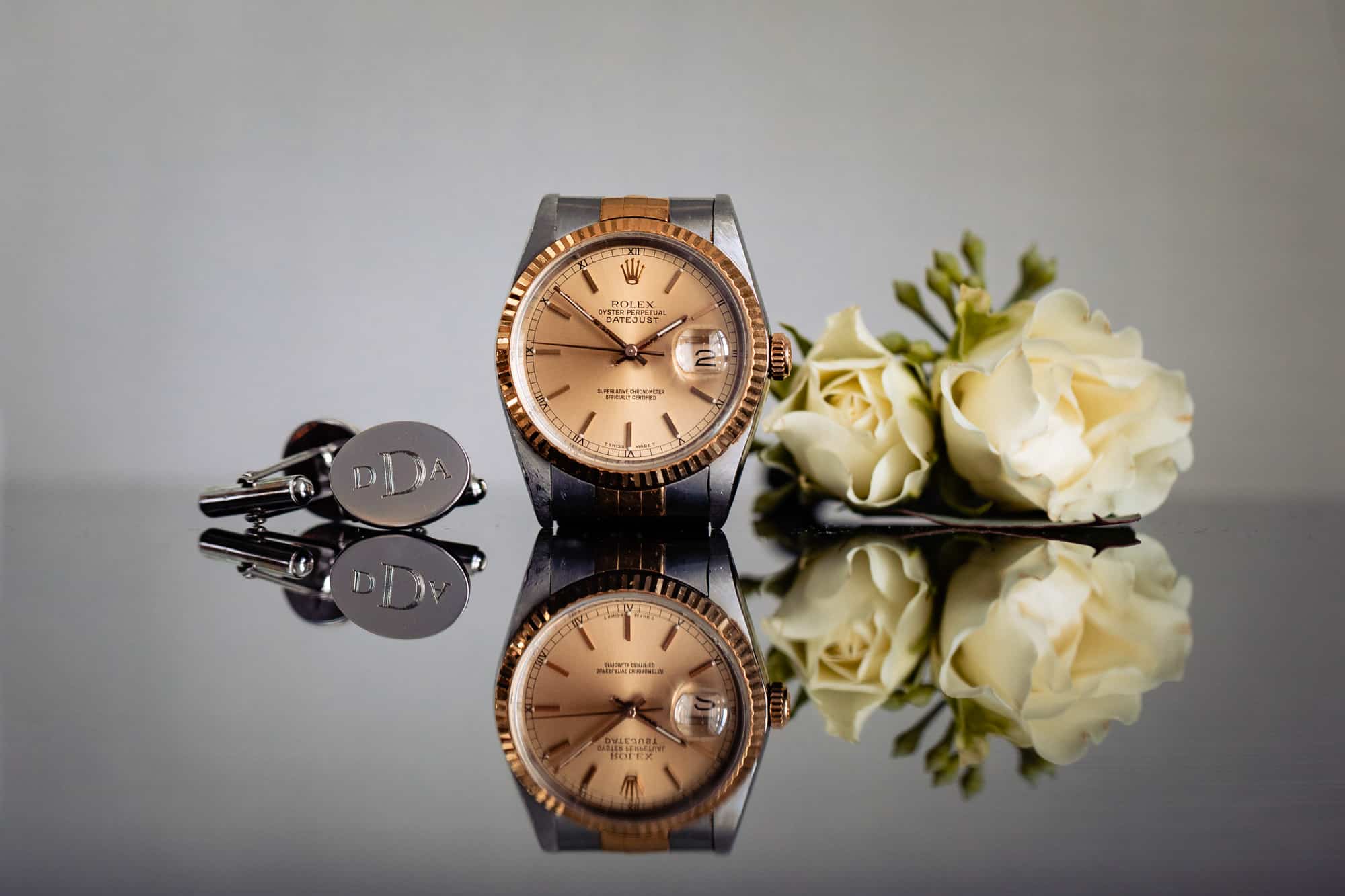 groom's accessories such as watch and boutonniere