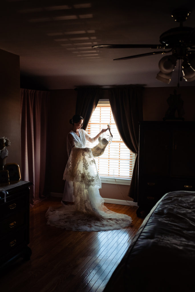 bride staring at her wedding dress