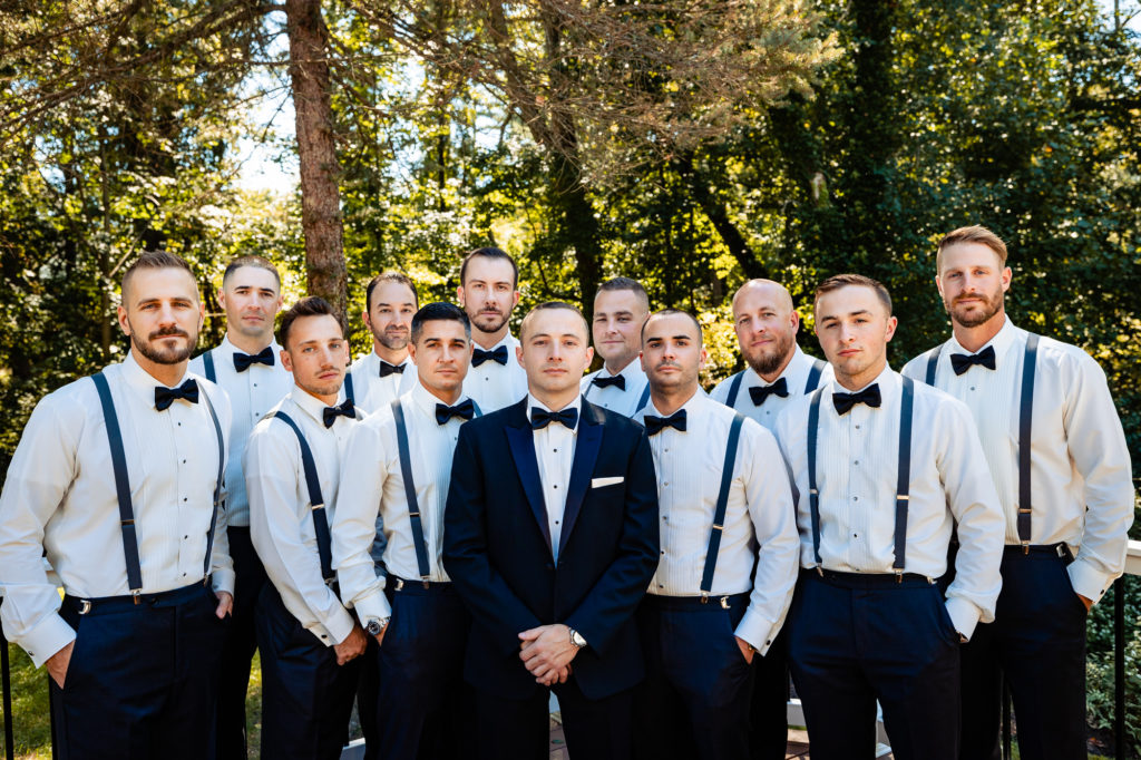 groom posing with his entourage