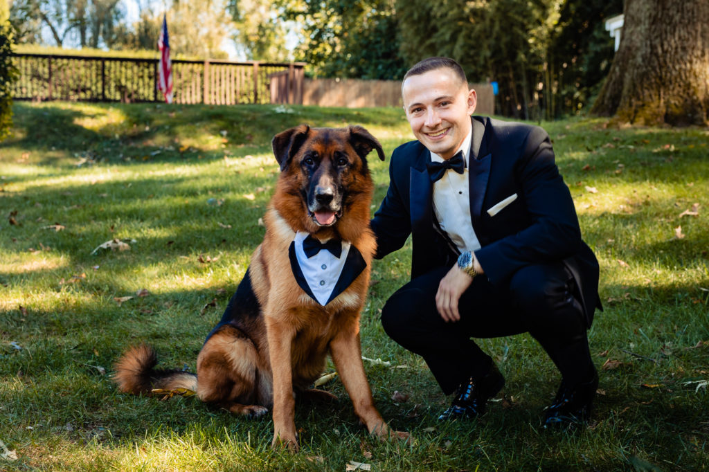 groom with his german shepherd dog