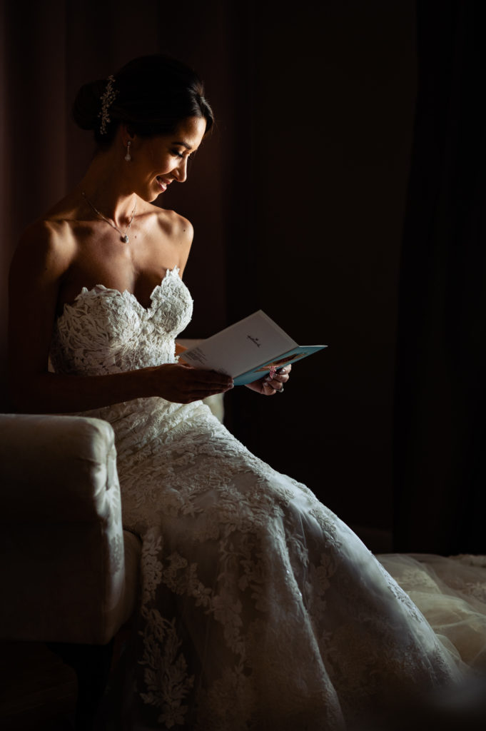 bride reading a letter from her husband