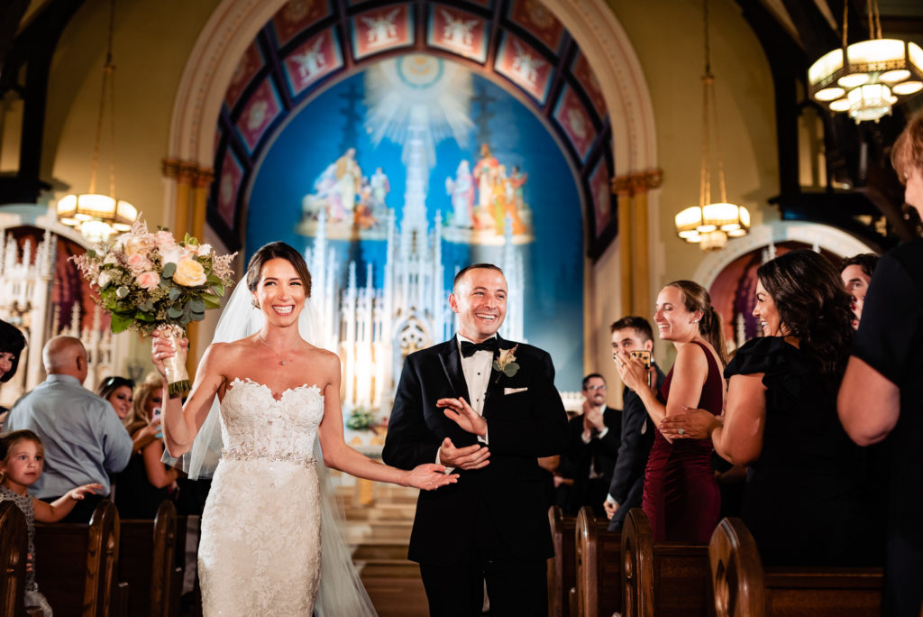 Newly married couple leaves the church