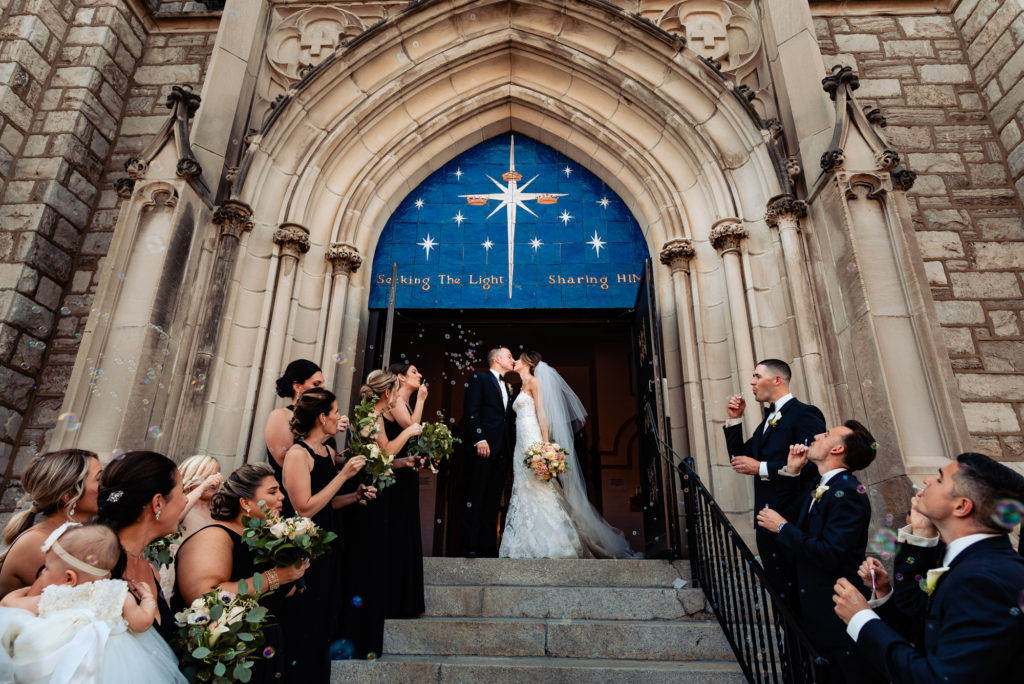 kissing couple outside the church
