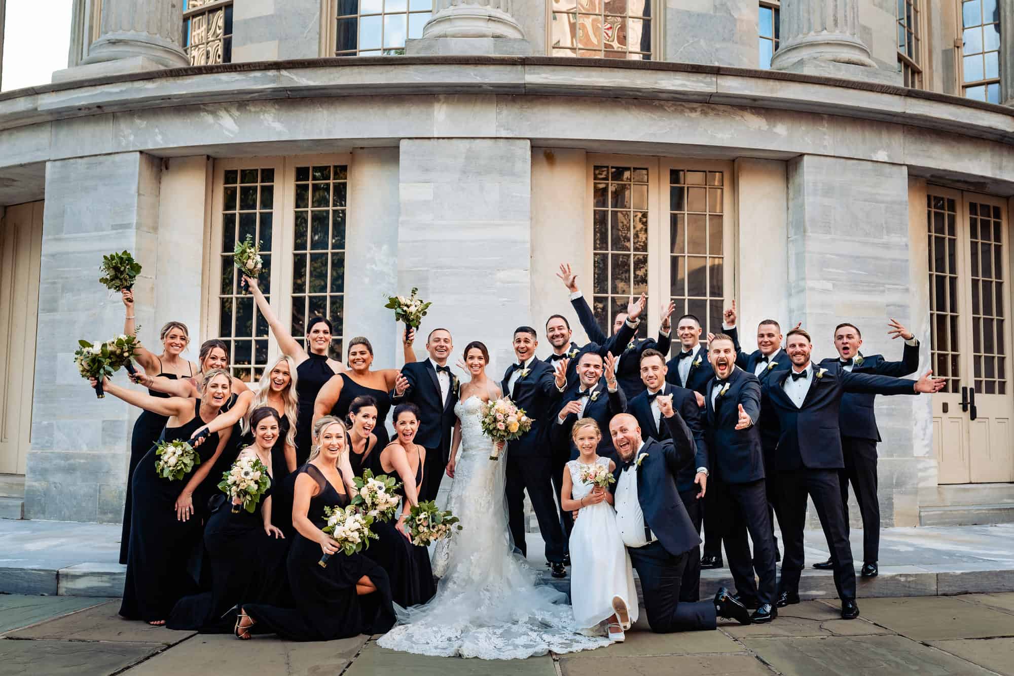 couple posing with the whole wedding party