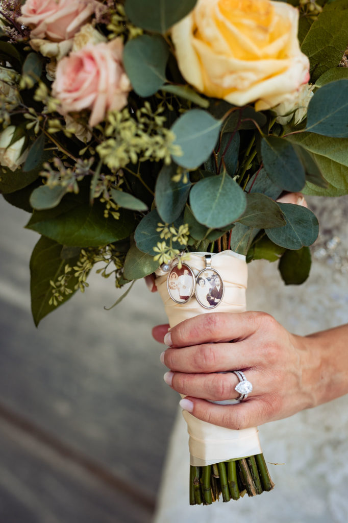 a bride's bouquet full of colorful roses