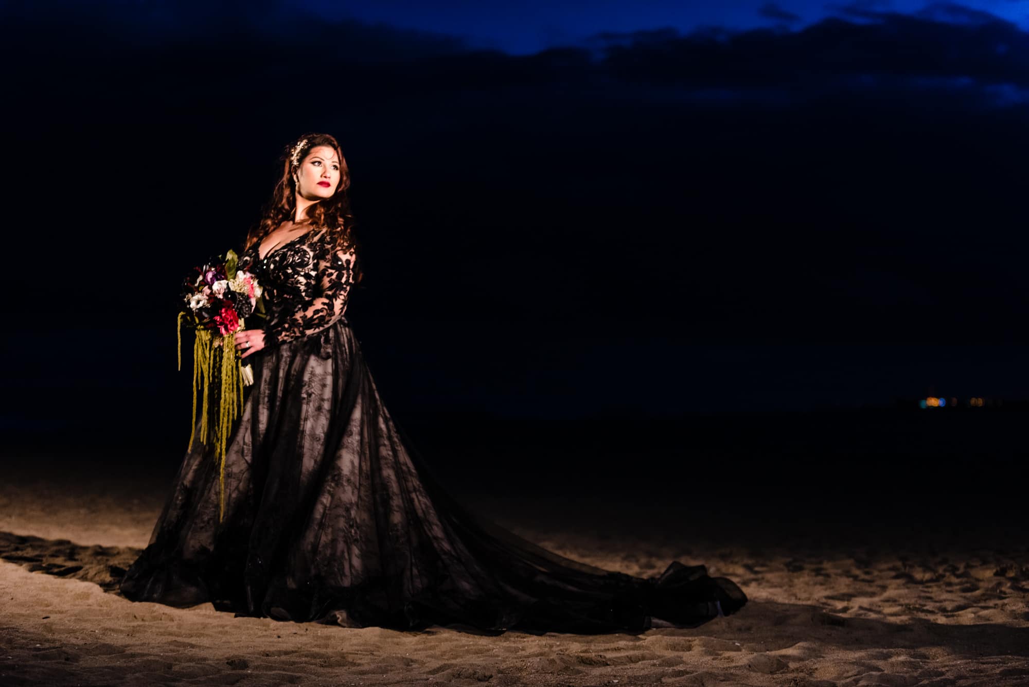 bridal shot along the beach after their halloween themed wedding