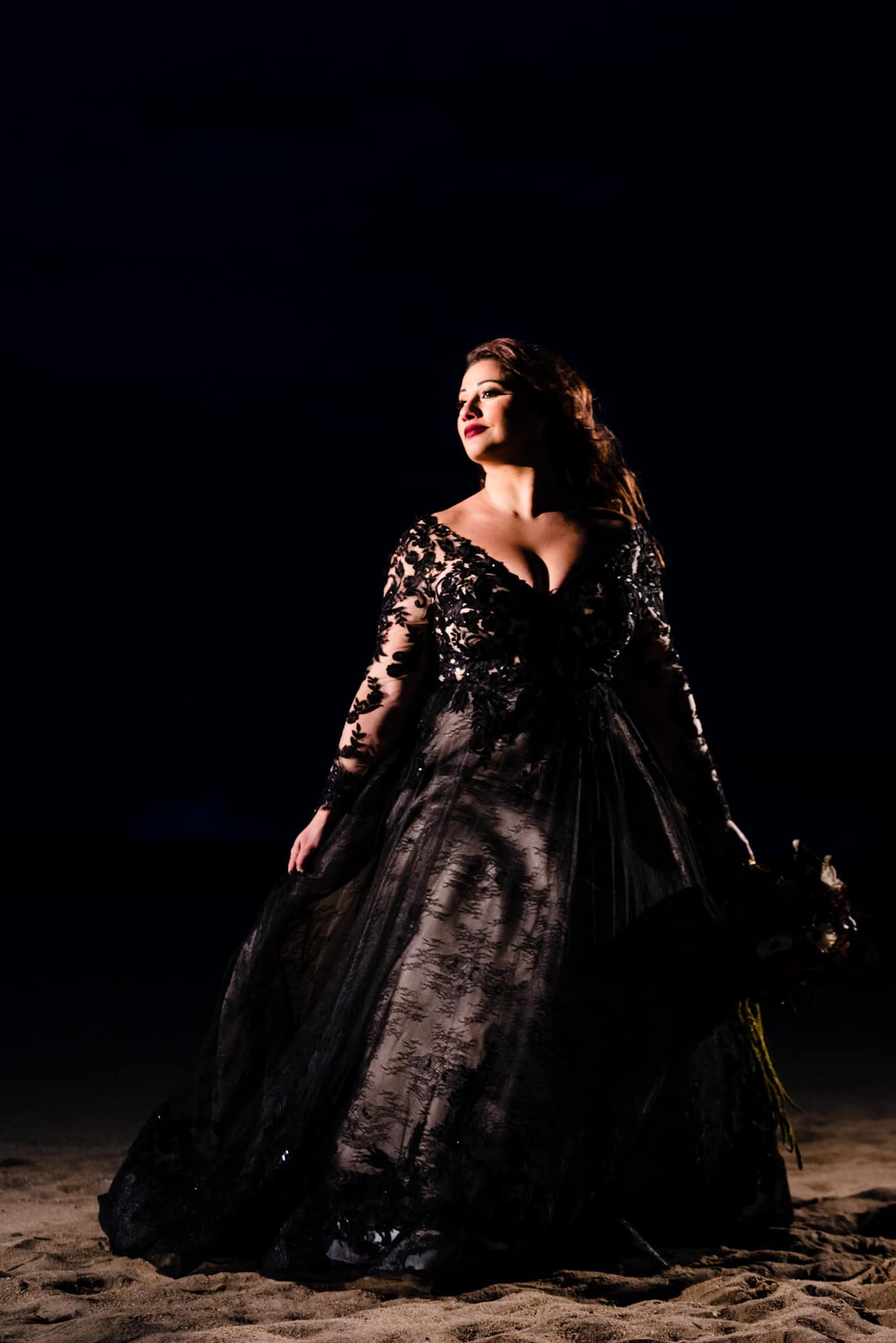 bridal portrait along the beach after their halloween themed wedding