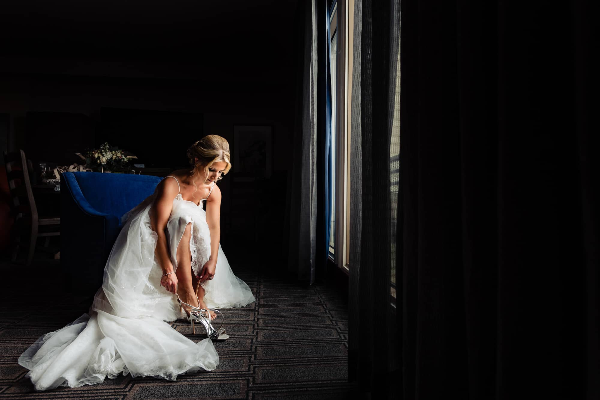 bride is wearing her shoes