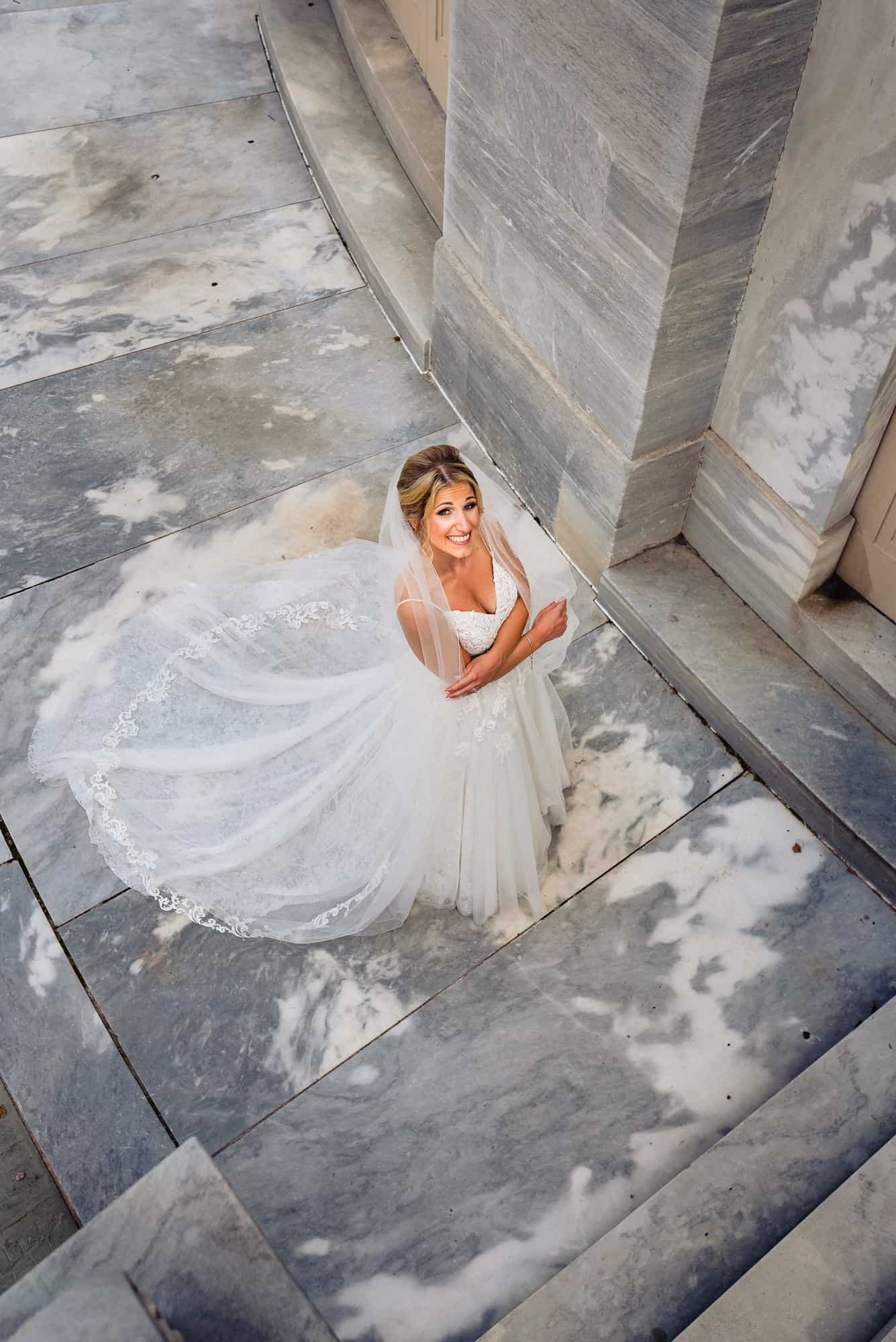 a smiling bride photographed from above