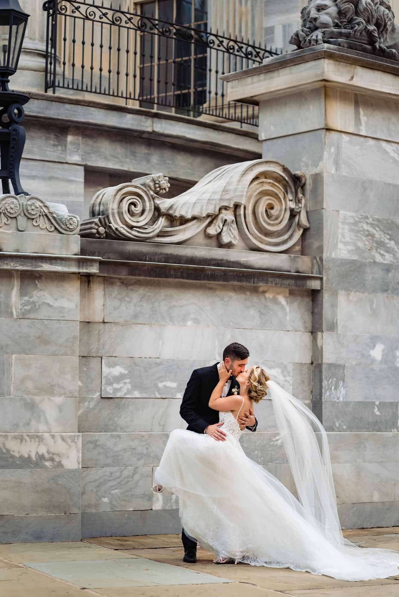 couple kissing outside the church