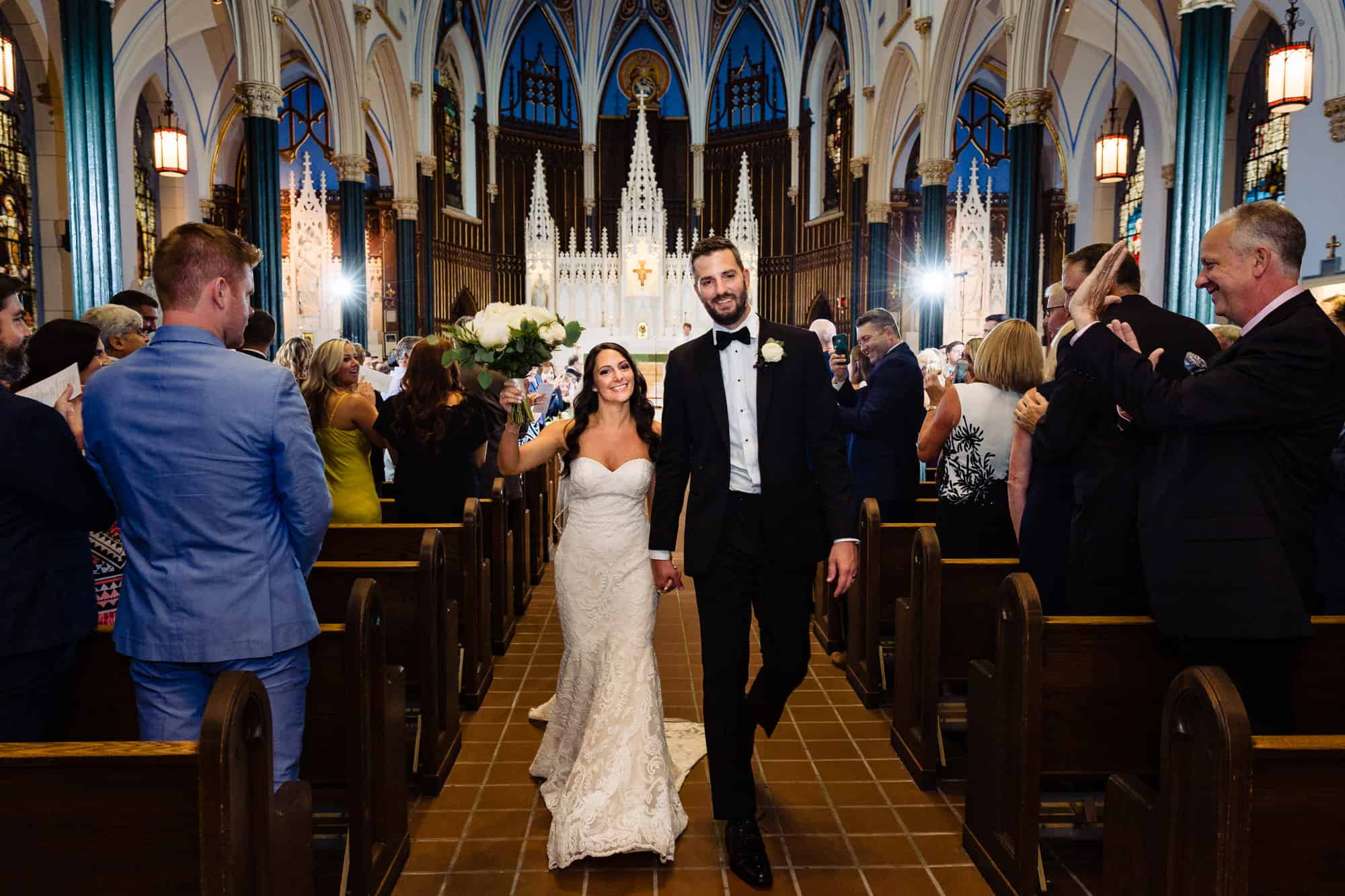 Newly married couple leave the church