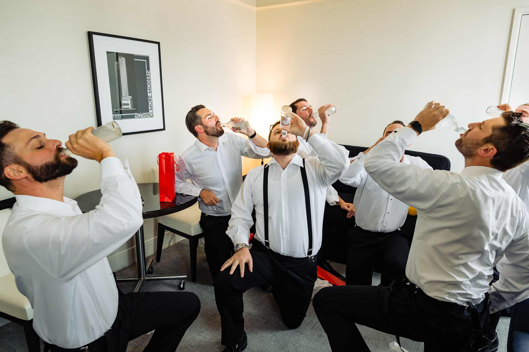 groom and his entourage drinking Champagne before the ceremony