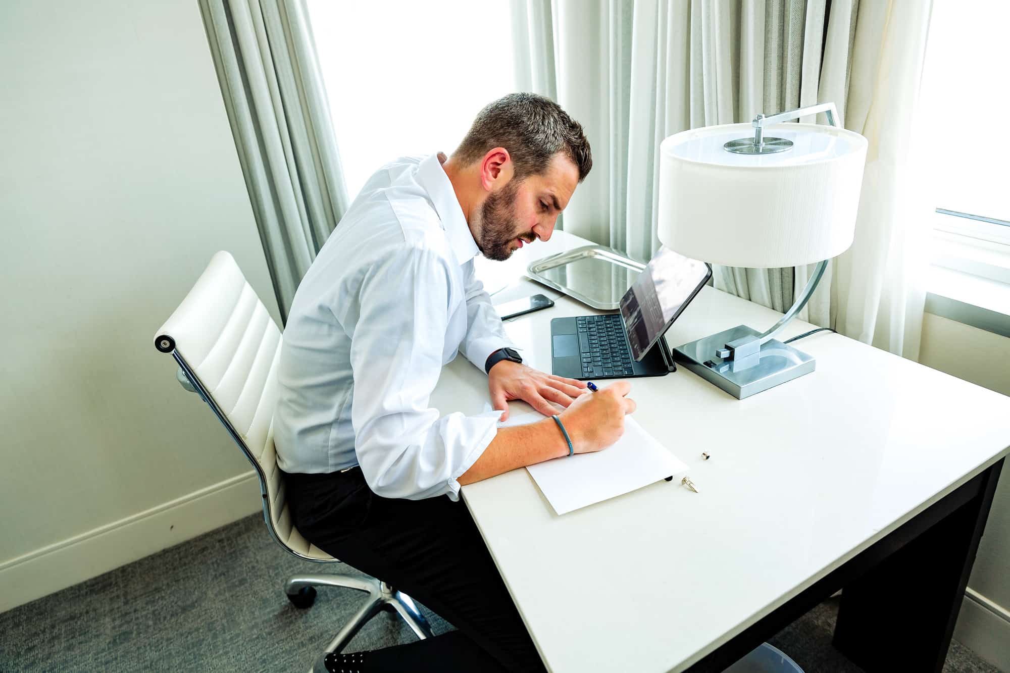 groom writing a note for her bride