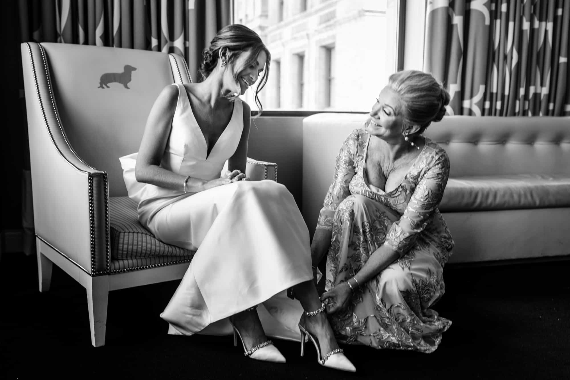 bride and her mother getting ready for the wedding