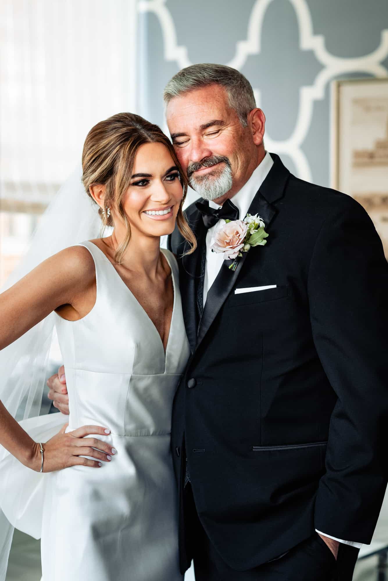 bride and her father smiling together