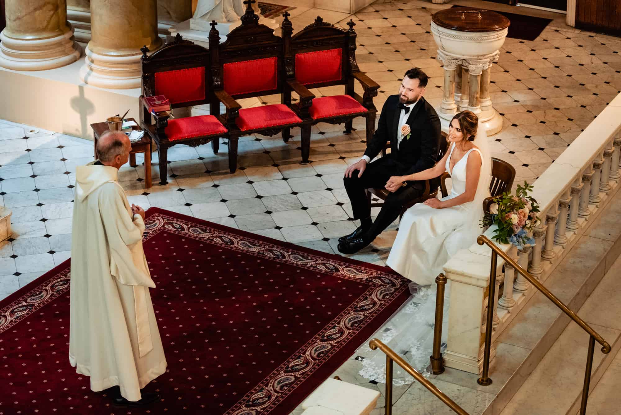 priest officiating the wedding ceremony