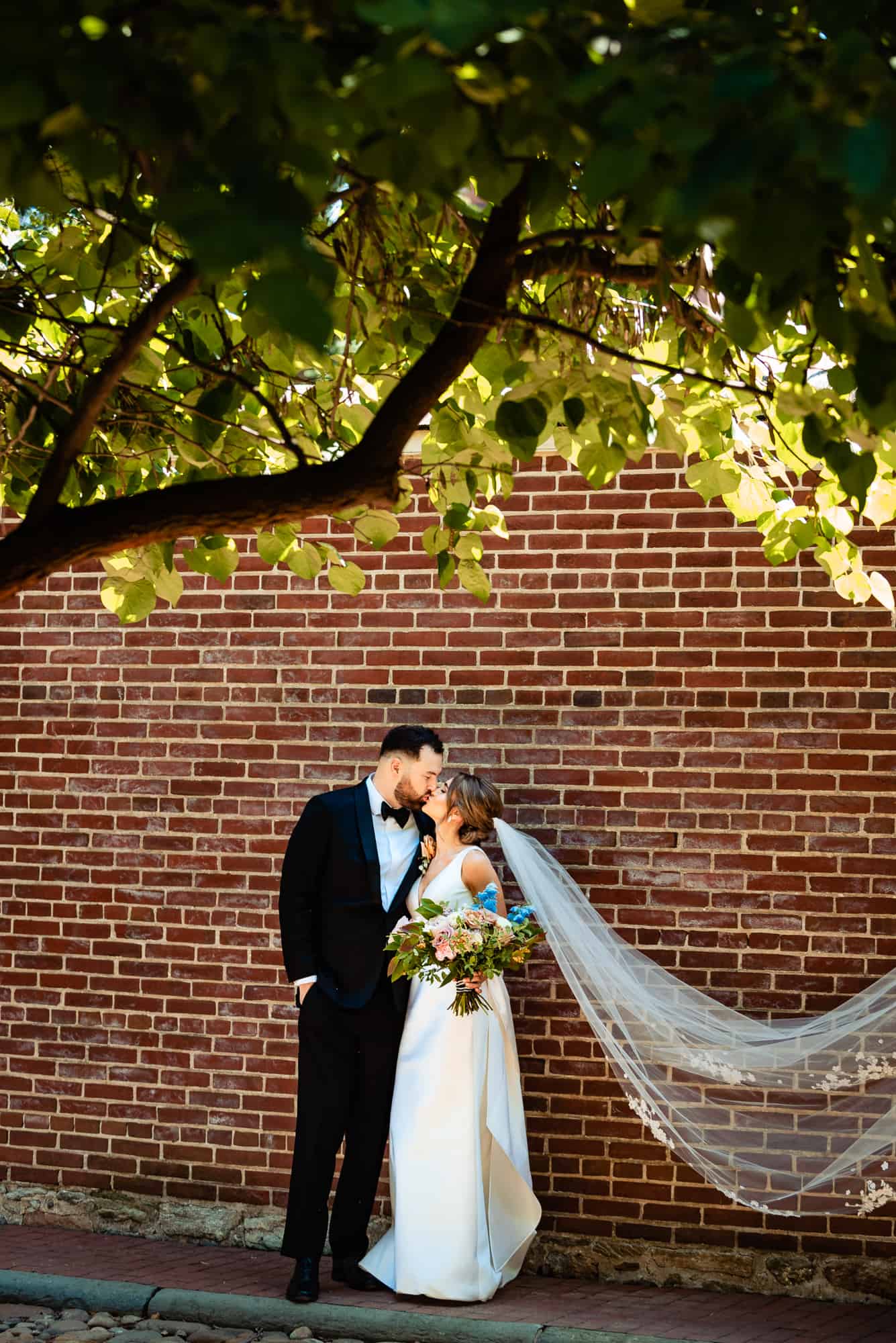 couple kissing outside the church