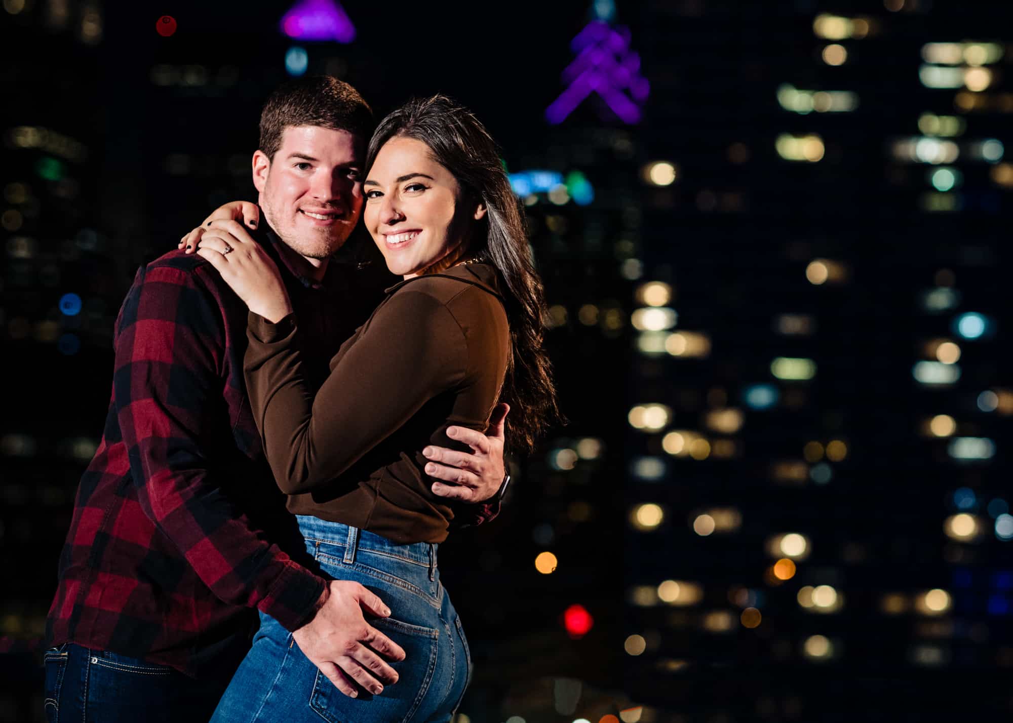 night shot of the couple taking a pose for their e-session at center city philly