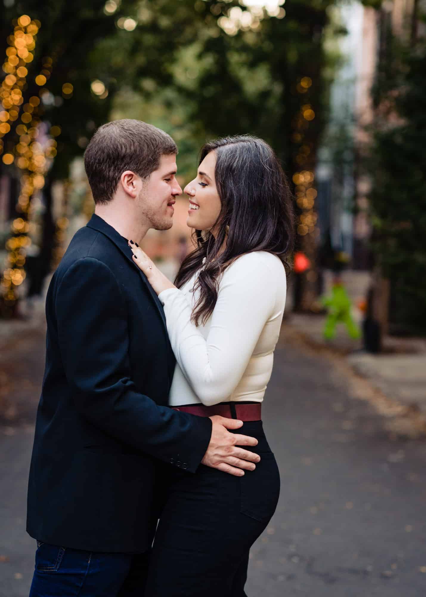 couples kisses for their e-session in center city philly